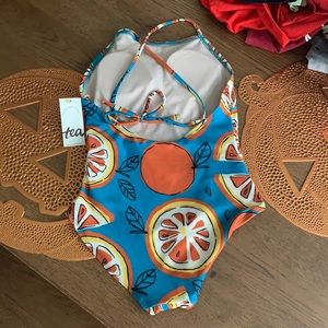 New with tags orange and teal suit